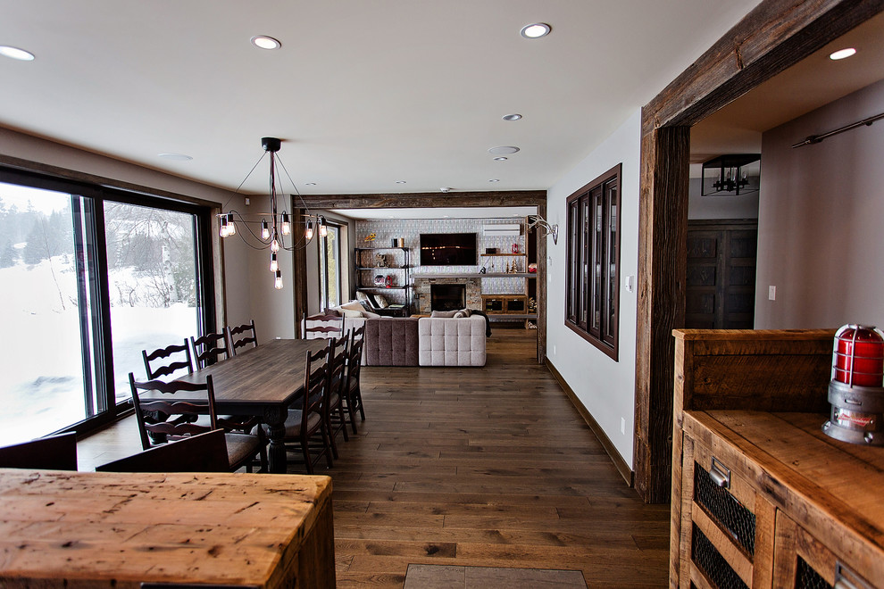 Inspiration for a large urban kitchen/dining room in Montreal with white walls and medium hardwood flooring.