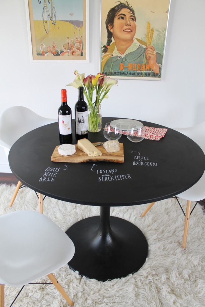 Inspiration for an eclectic dining room remodel in Los Angeles with white walls