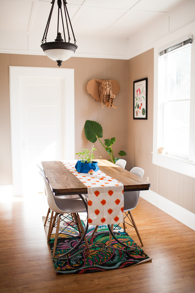 Example of an eclectic dining room design in San Luis Obispo with beige walls
