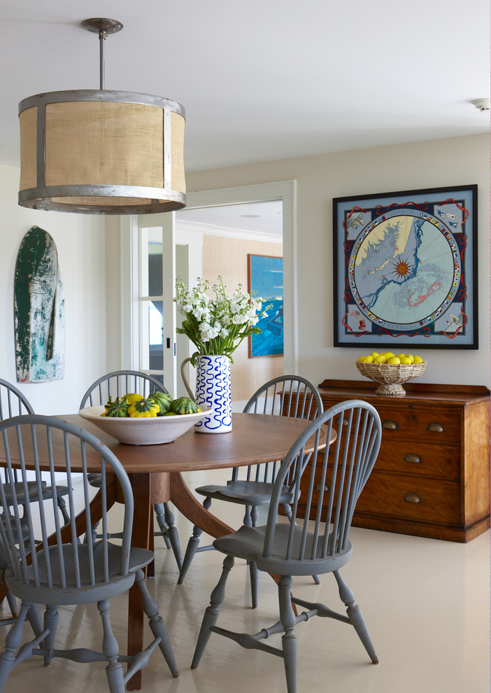 Inspiration for a mid-sized country porcelain tile and beige floor enclosed dining room remodel in Boston with beige walls and no fireplace