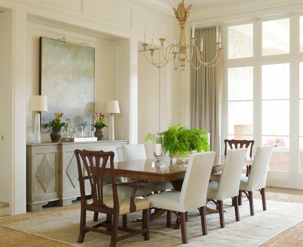 Design ideas for a classic dining room in Charlotte with white walls and feature lighting.