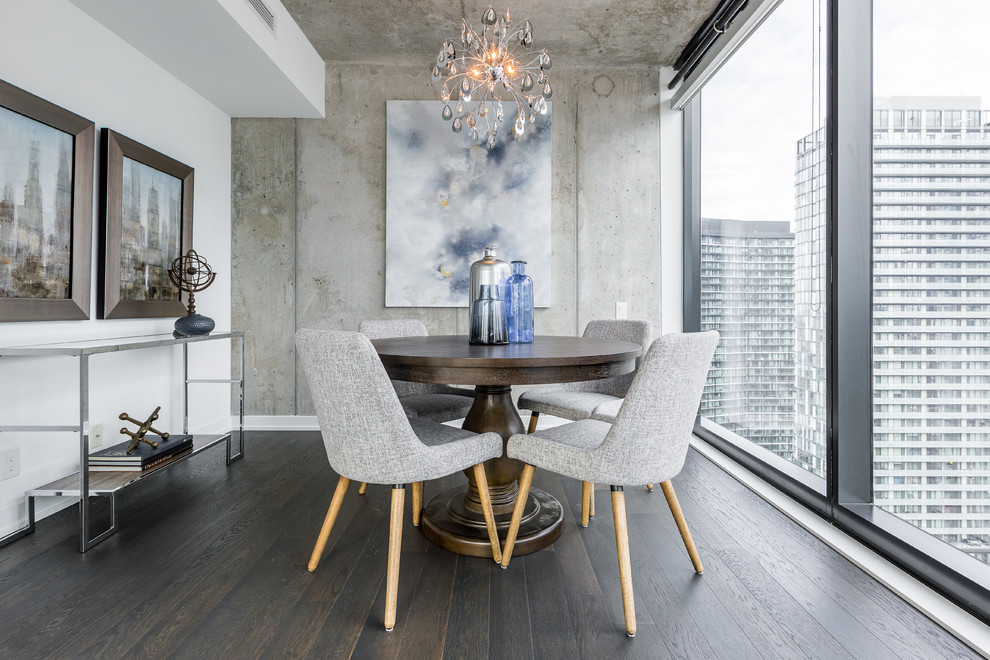 Small contemporary open plan dining room in Toronto with grey walls, dark hardwood flooring and brown floors.
