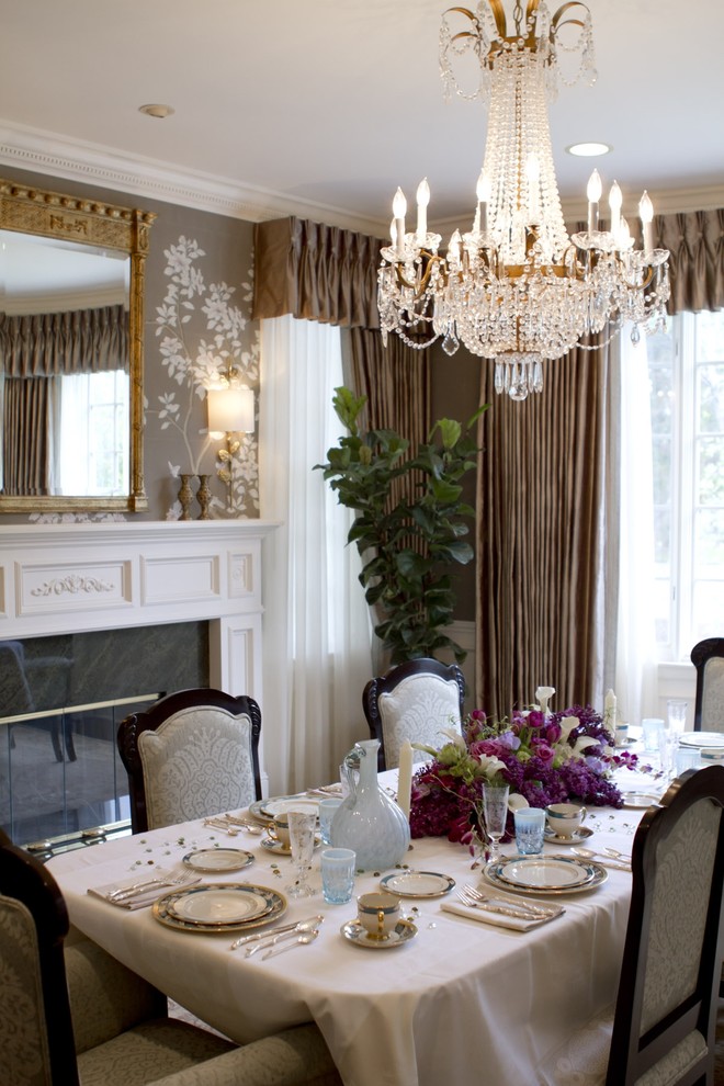 Elegant dining room photo in Los Angeles with a standard fireplace