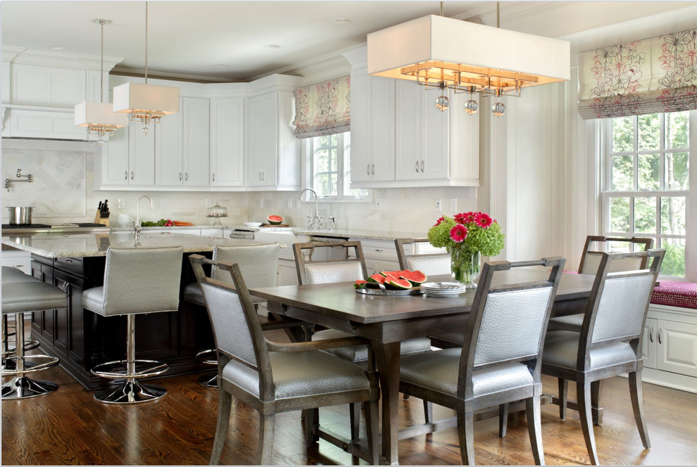 Large traditional kitchen/dining room in New York with medium hardwood flooring and grey walls.