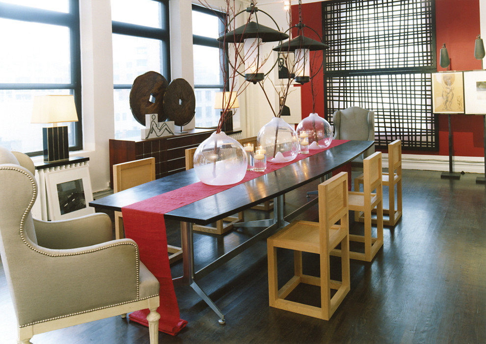 Inspiration for an eclectic dark wood floor dining room remodel in New York with red walls