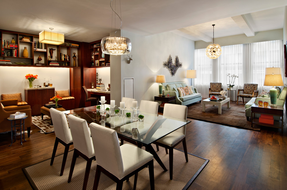 Photo of a contemporary open plan dining room in New York with feature lighting.