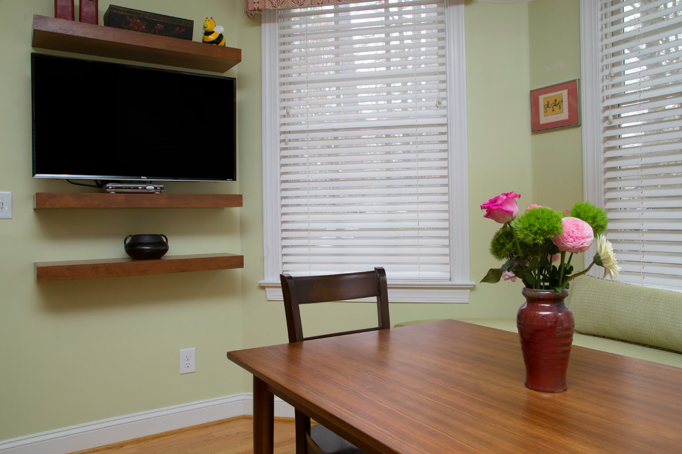 Medium sized classic kitchen/dining room in Raleigh with green walls, medium hardwood flooring and orange floors.