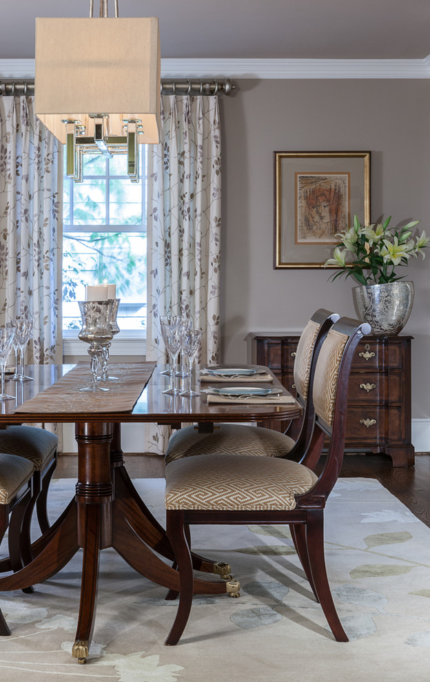 Traditional dining room in DC Metro with grey walls and dark hardwood flooring.