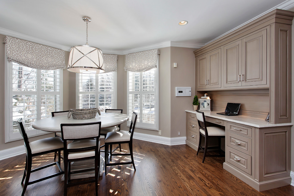 Inspiration for a timeless dark wood floor dining room remodel in Chicago with beige walls