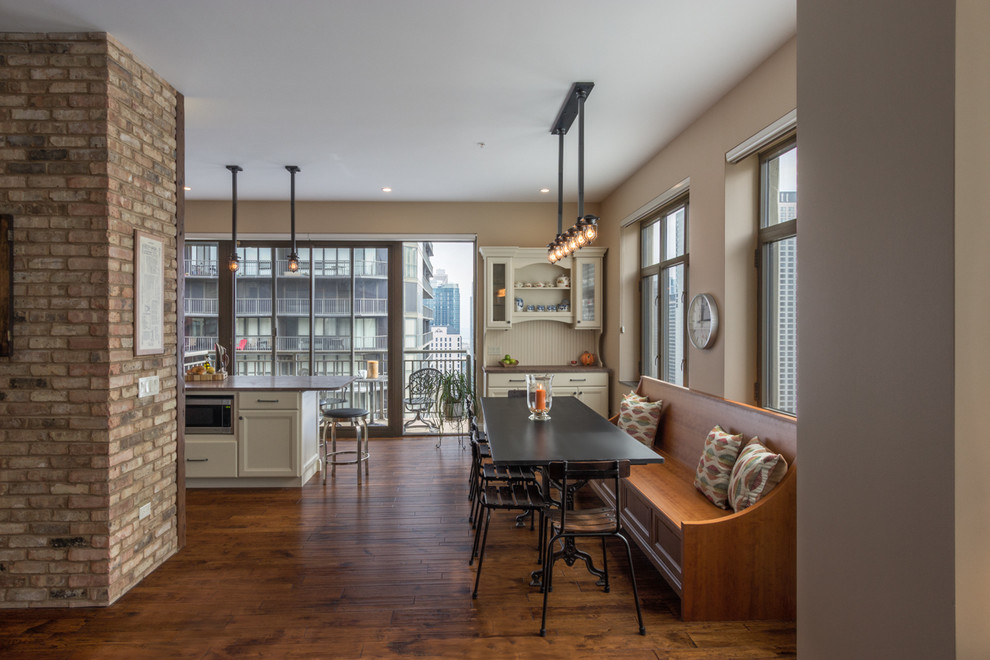 Example of a mid-sized trendy dark wood floor kitchen/dining room combo design in Chicago with beige walls and no fireplace