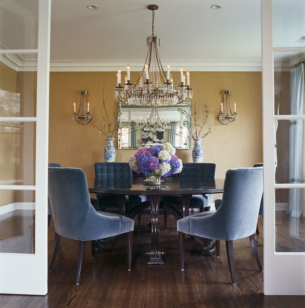 Bohemian enclosed dining room in Chicago with dark hardwood flooring.