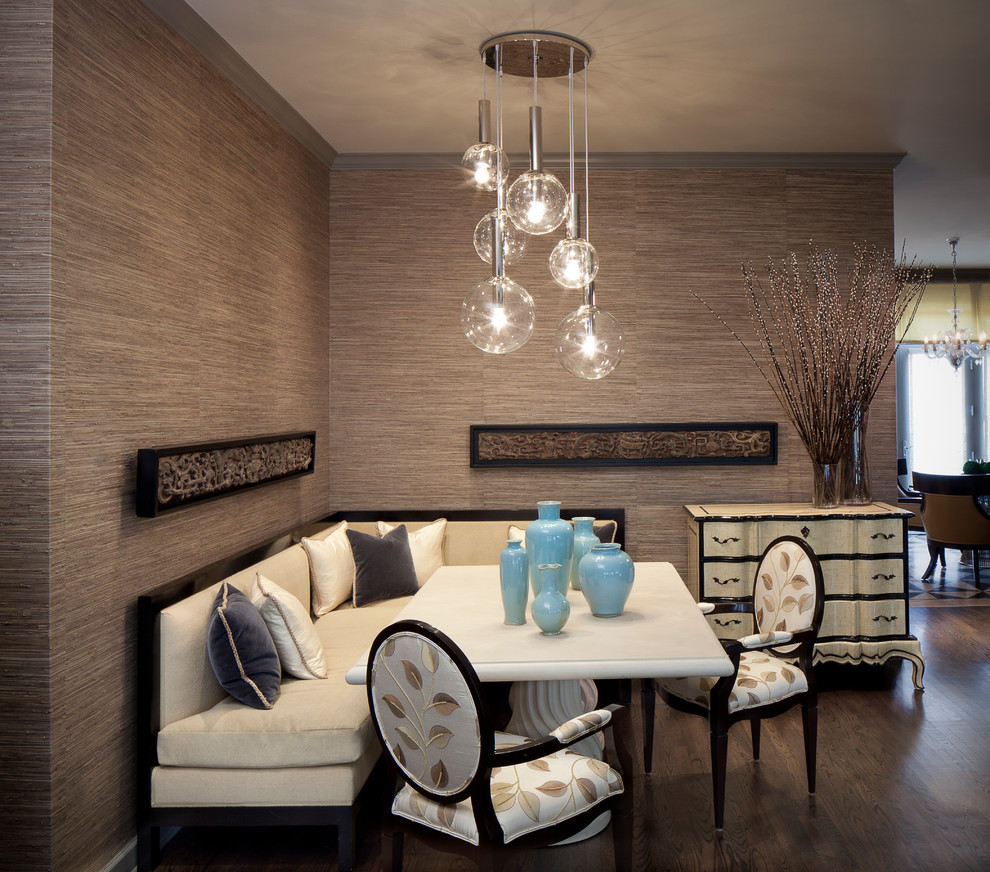 Contemporary dining room in Chicago with brown walls and dark hardwood flooring.