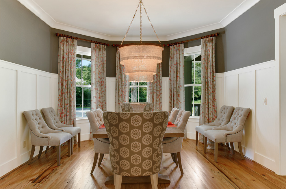 Inspiration for a victorian enclosed dining room in Charlotte with grey walls and medium hardwood flooring.