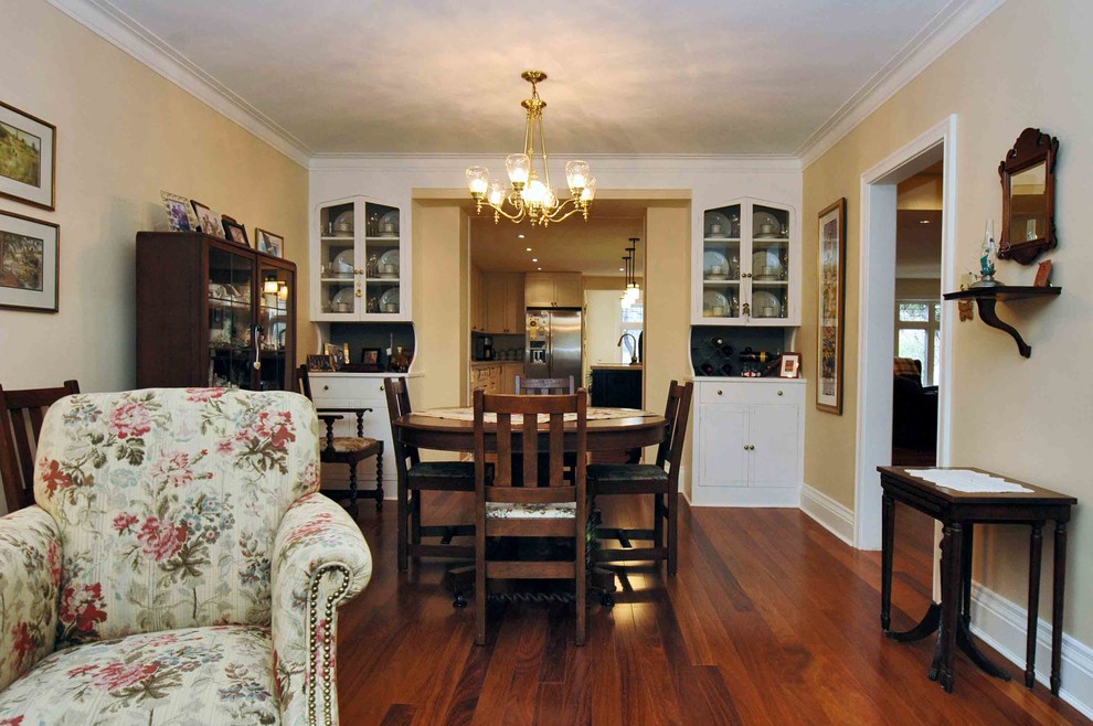Photo of a medium sized midcentury open plan dining room in Toronto with beige walls and medium hardwood flooring.