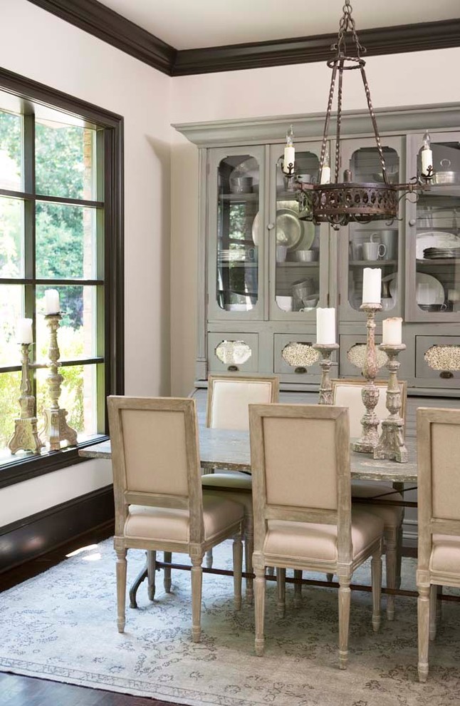 This is an example of a medium sized traditional enclosed dining room in Other with white walls and dark hardwood flooring.