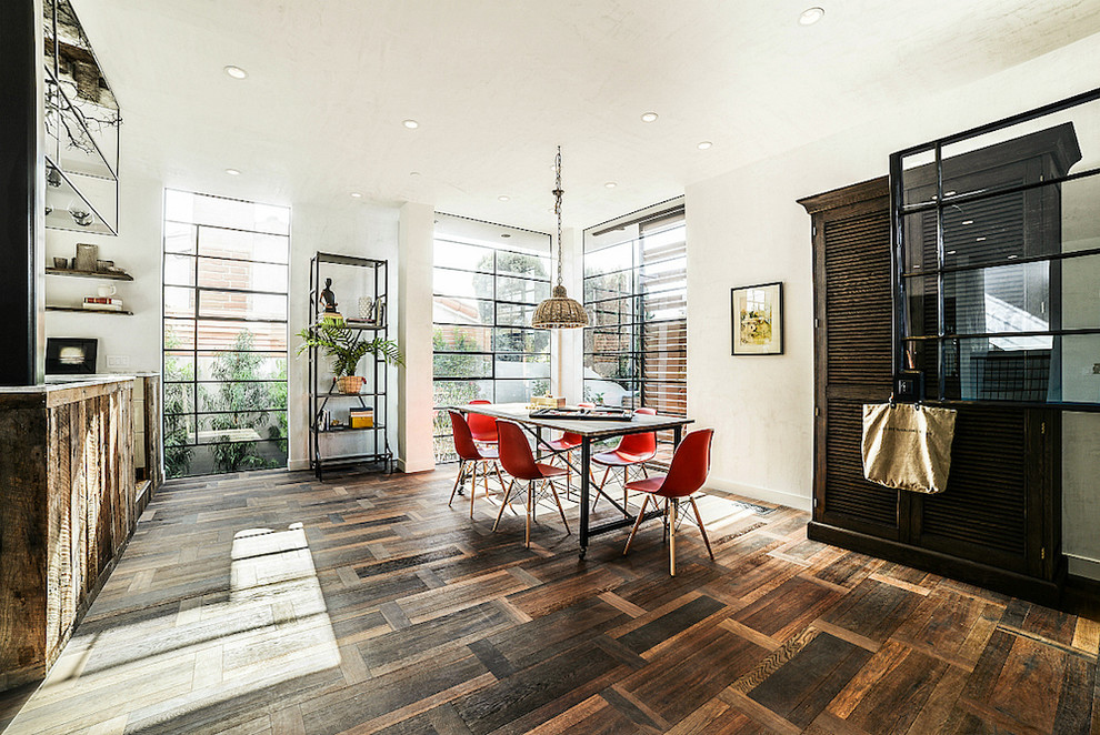 Great room - large dark wood floor great room idea in Los Angeles with white walls