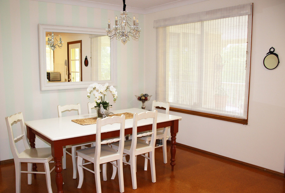 Photo of a medium sized farmhouse kitchen/dining room in Other with white walls and cork flooring.