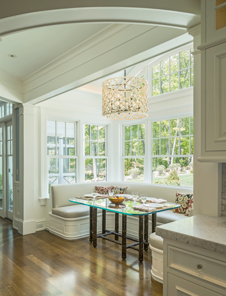 Kitchen/dining room combo - traditional medium tone wood floor and brown floor kitchen/dining room combo idea in Boston with white walls