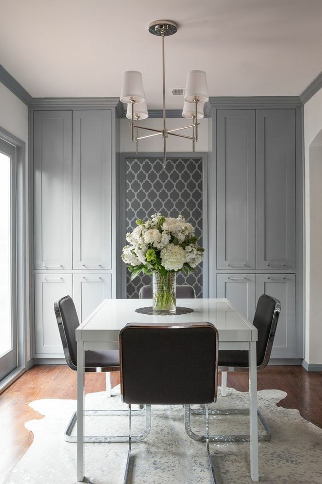 Mid-sized transitional dark wood floor and brown floor enclosed dining room photo in Los Angeles with white walls and no fireplace