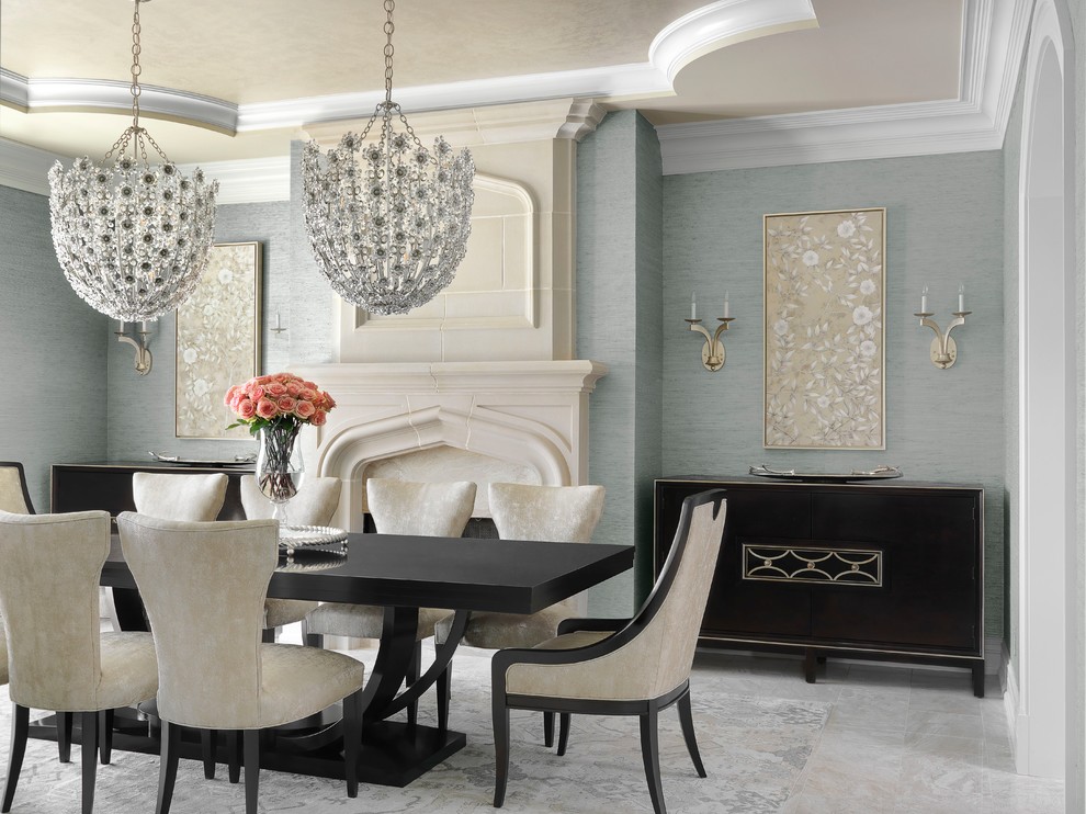 На фото: столовая в классическом стиле с синими стенами, стандартным камином, фасадом камина из камня и серым полом