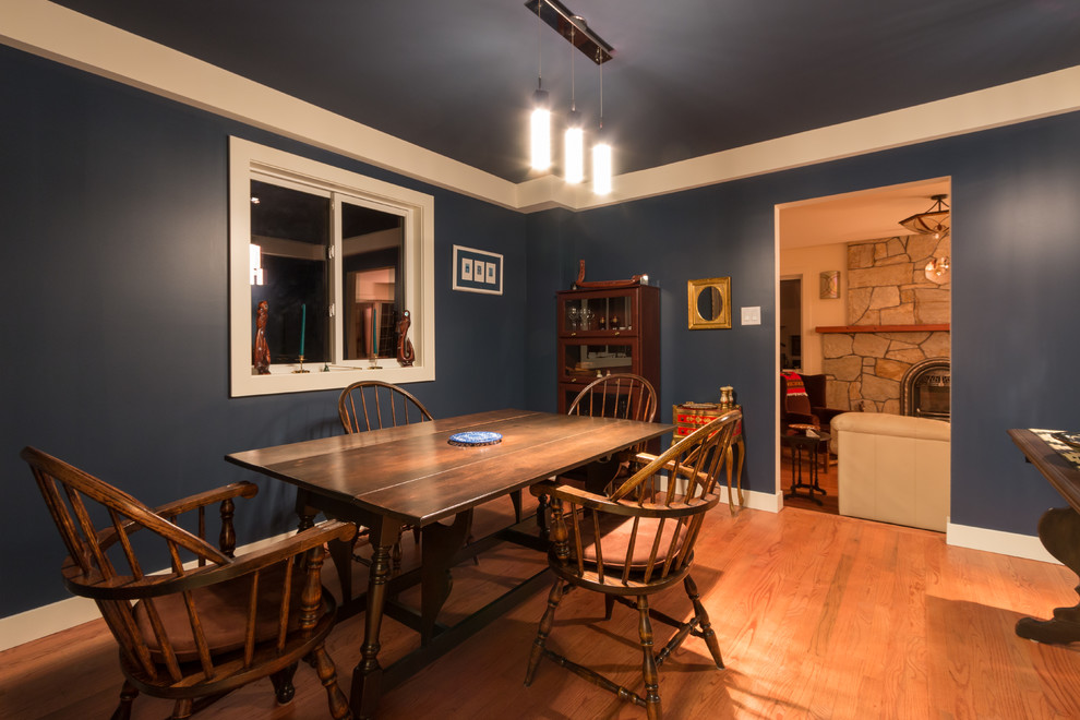 Inspiration for a medium sized traditional enclosed dining room in Vancouver with blue walls, medium hardwood flooring and no fireplace.