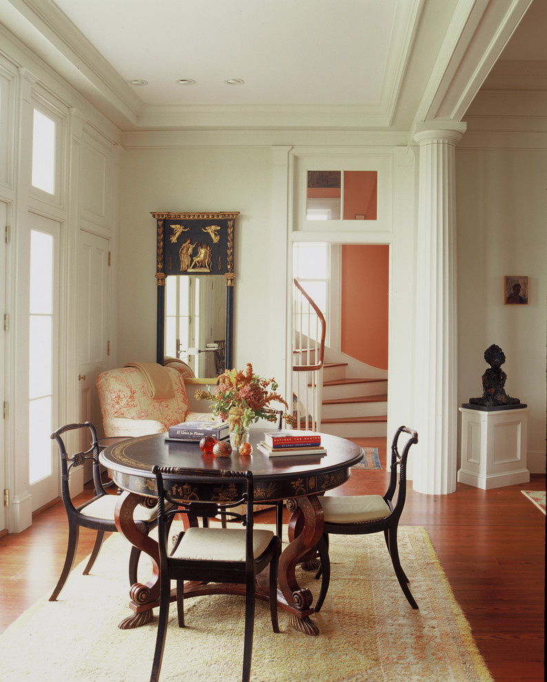 Great room - mid-sized traditional medium tone wood floor great room idea in New York with white walls