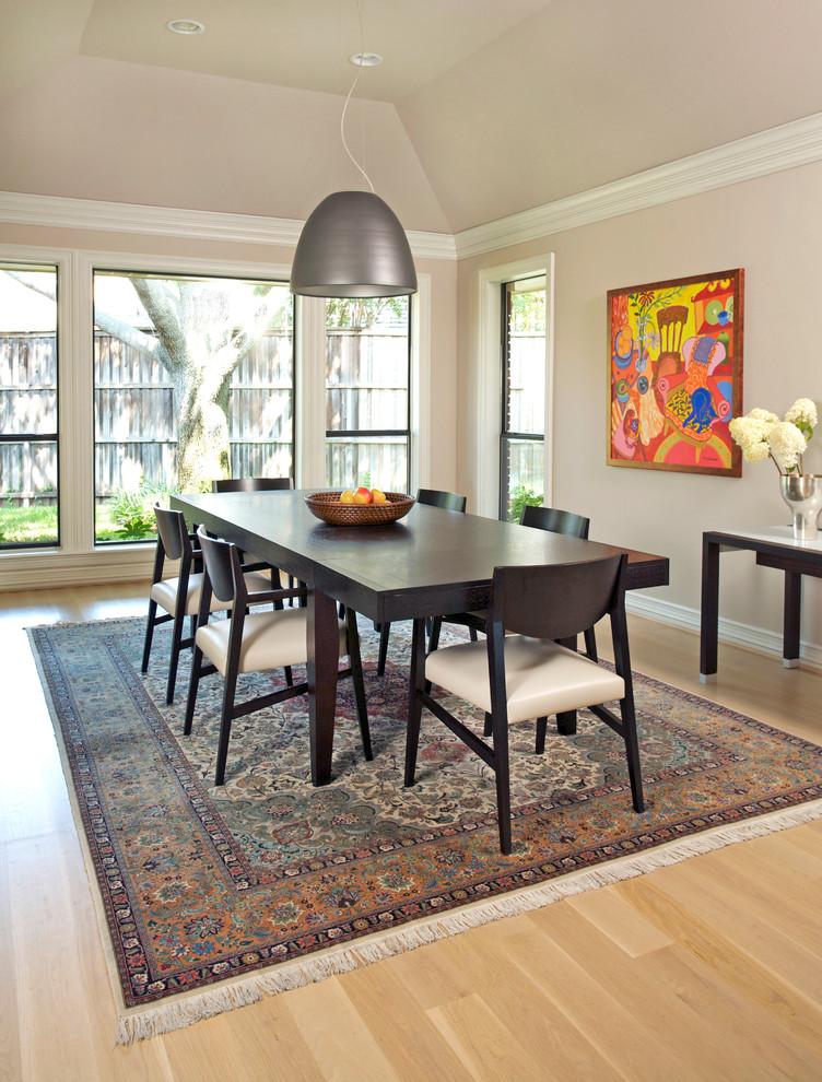 Photo of a traditional enclosed dining room in Dallas with grey walls and light hardwood flooring.