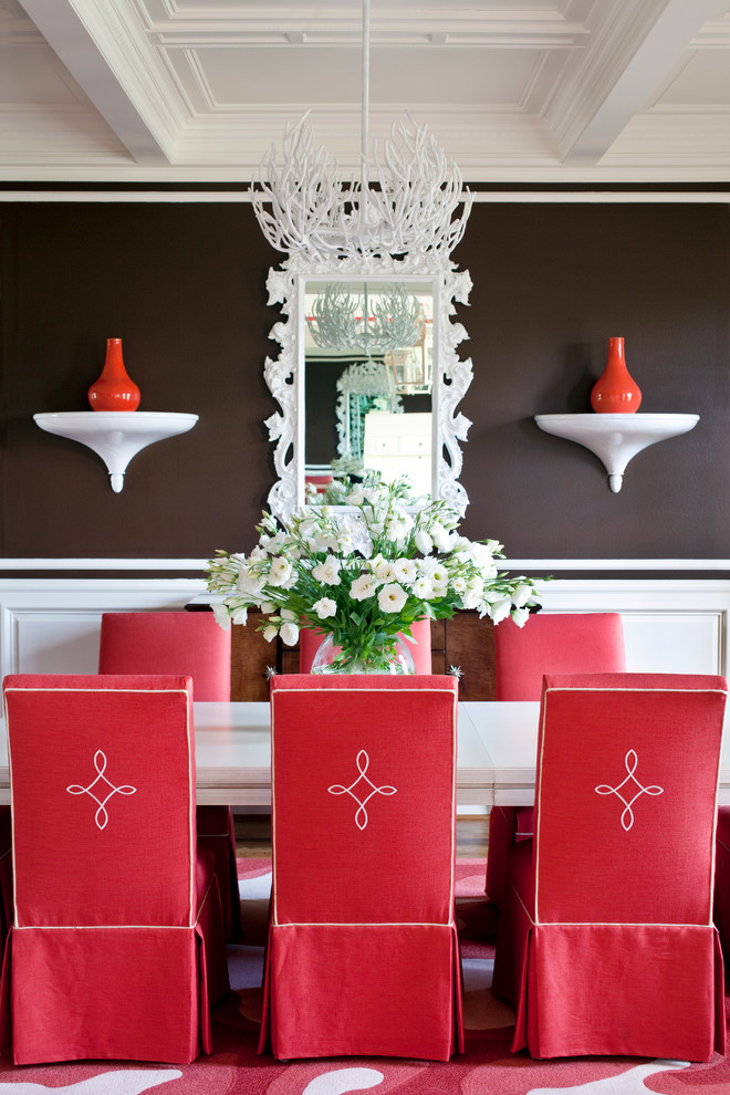 Example of a large classic medium tone wood floor dining room design in Little Rock with brown walls and no fireplace