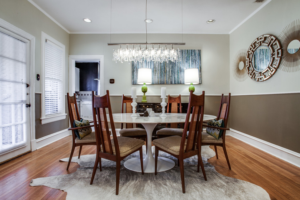 Enclosed dining room - mid-sized transitional medium tone wood floor enclosed dining room idea in Dallas with gray walls and no fireplace