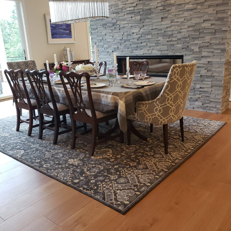 Large trendy carpeted and brown floor kitchen/dining room combo photo in Seattle with beige walls, a standard fireplace and a stone fireplace