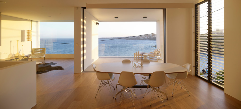 Example of a minimalist great room design in Sydney with white walls