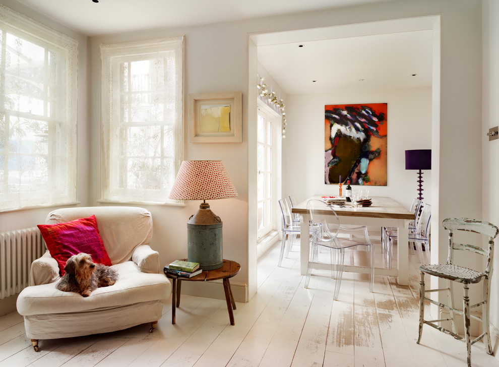 Dining room - shabby-chic style painted wood floor and white floor dining room idea in Kent with white walls
