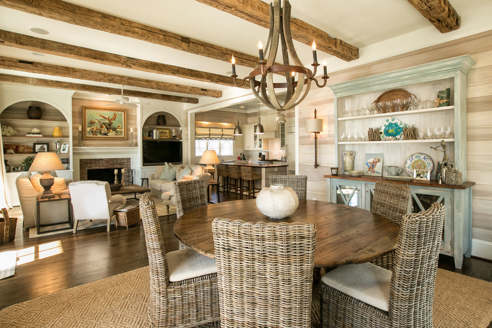 Example of a beach style dark wood floor dining room design in Raleigh