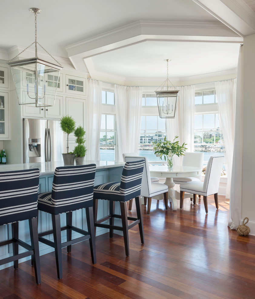 Inspiration for a mid-sized coastal medium tone wood floor kitchen/dining room combo remodel in Providence with white walls