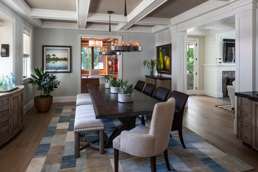 Beach style enclosed dining room in Los Angeles with grey walls and medium hardwood flooring.