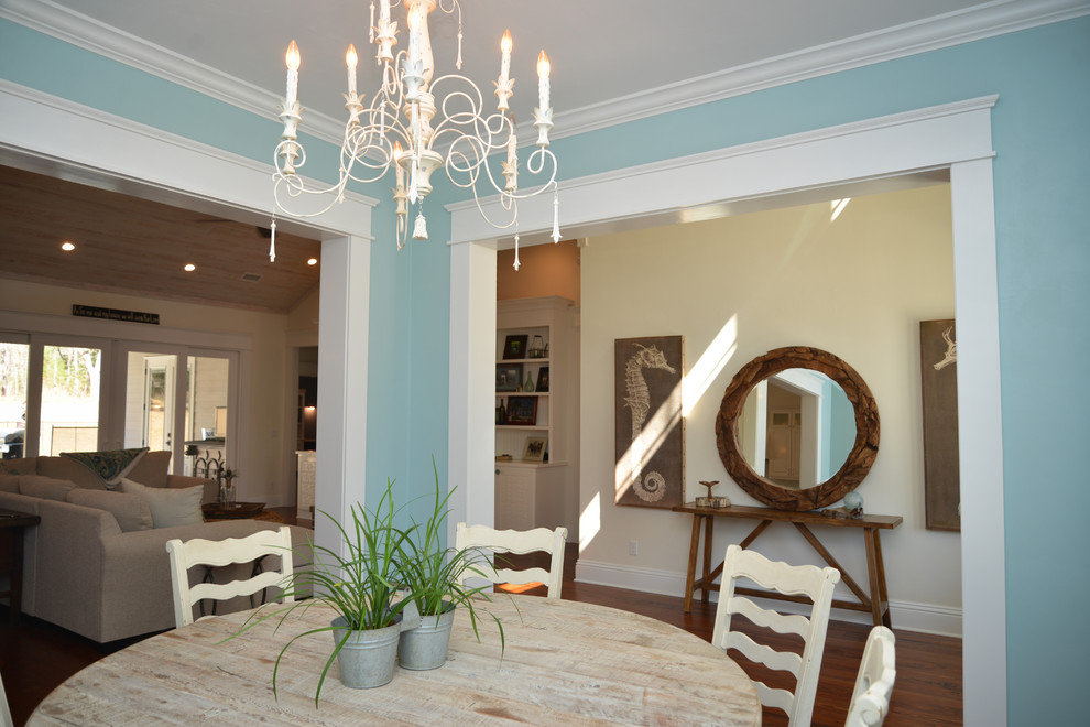 Example of a mid-sized cottage medium tone wood floor kitchen/dining room combo design in Atlanta with blue walls