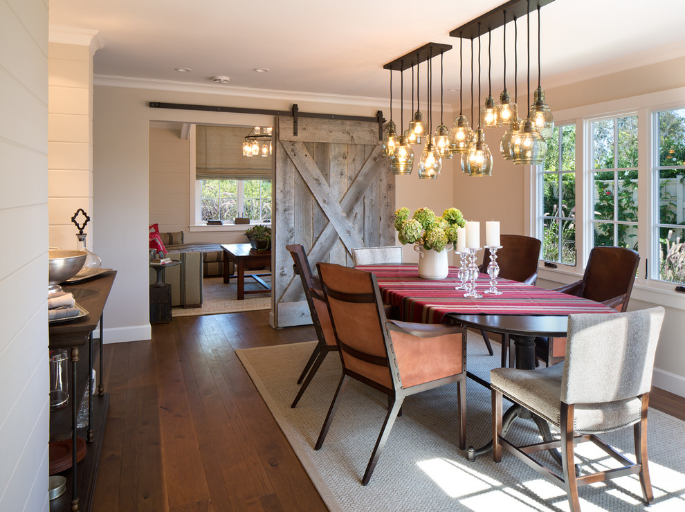 Example of a cottage medium tone wood floor dining room design in San Diego with beige walls