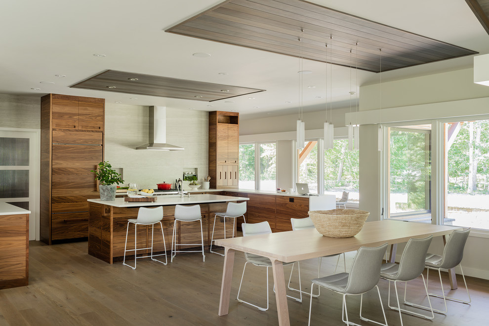 Inspiration for a rural kitchen/dining room in Boston with beige walls, medium hardwood flooring and brown floors.