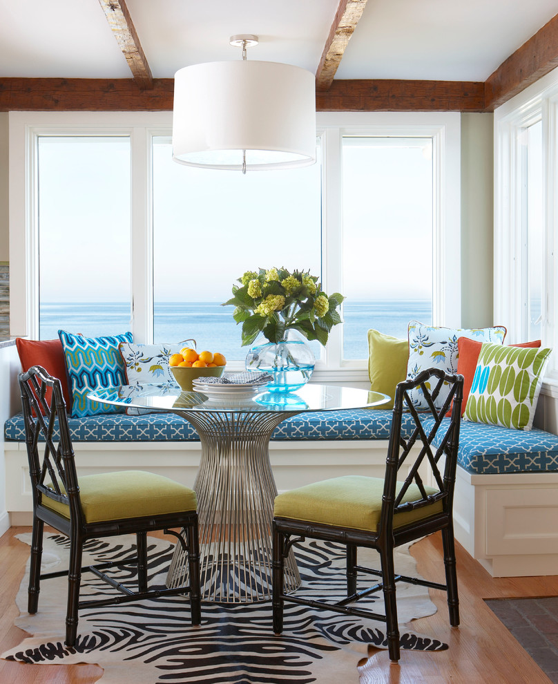 Example of a mid-sized beach style medium tone wood floor kitchen/dining room combo design in Boston with beige walls and no fireplace