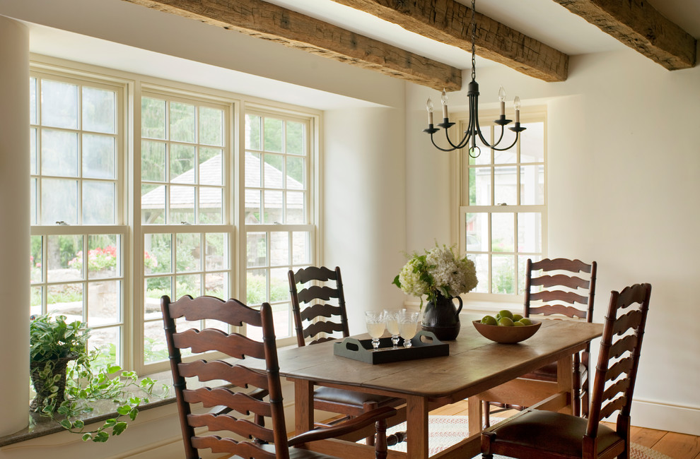 Example of a country kitchen/dining room combo design in Philadelphia with white walls