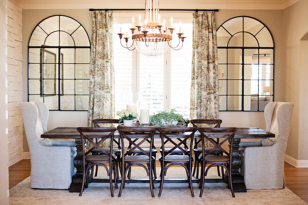 Medium sized traditional enclosed dining room in Austin with beige walls and medium hardwood flooring.