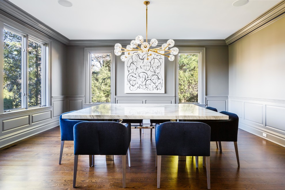 Classic enclosed dining room in New York with grey walls, dark hardwood flooring and brown floors.