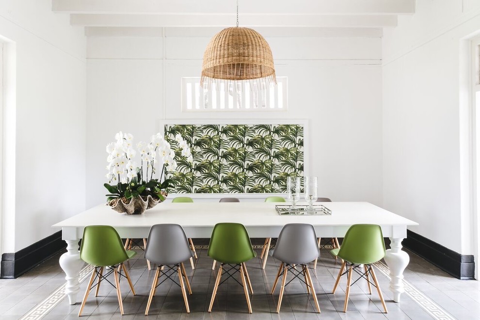 Inspiration for a world-inspired dining room in Singapore with white walls and grey floors.