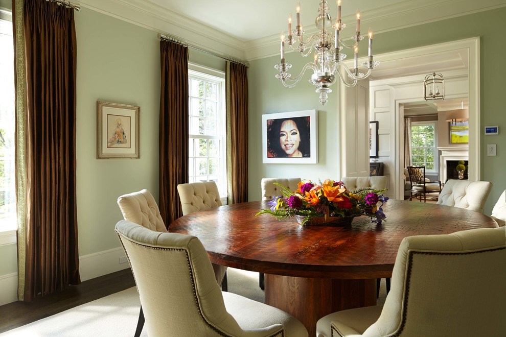 Inspiration for a classic enclosed dining room in Minneapolis with green walls and dark hardwood flooring.