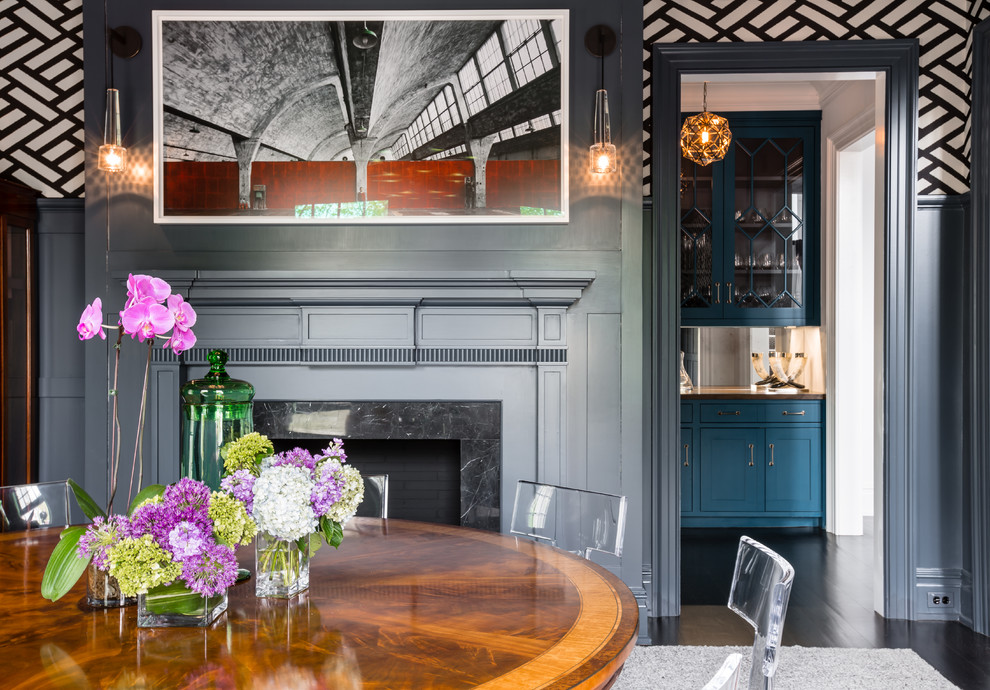 Design ideas for a traditional dining room in New York with grey walls, dark hardwood flooring and a standard fireplace.
