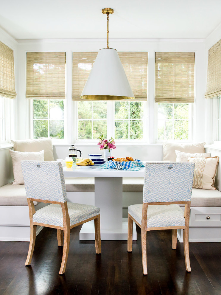 Inspiration for a classic dining room in New York with white walls and dark hardwood flooring.
