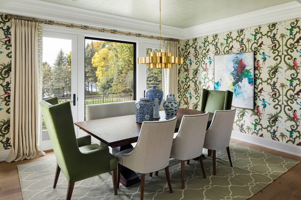 Medium sized classic dining room in Minneapolis with multi-coloured walls, medium hardwood flooring and brown floors.