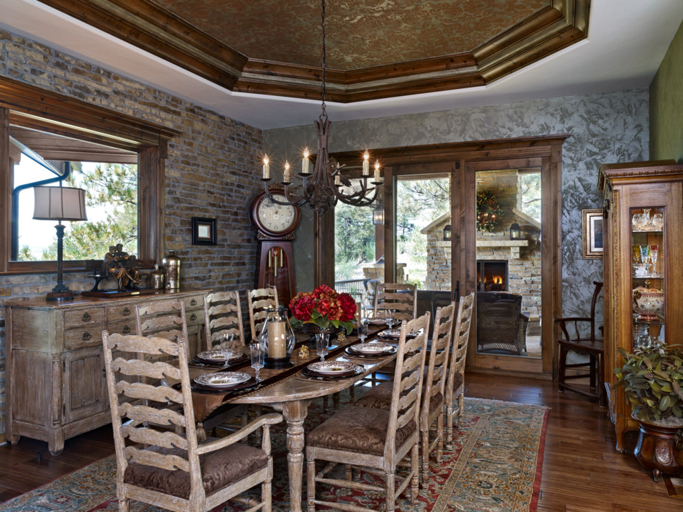 Example of a mountain style dark wood floor enclosed dining room design in Denver