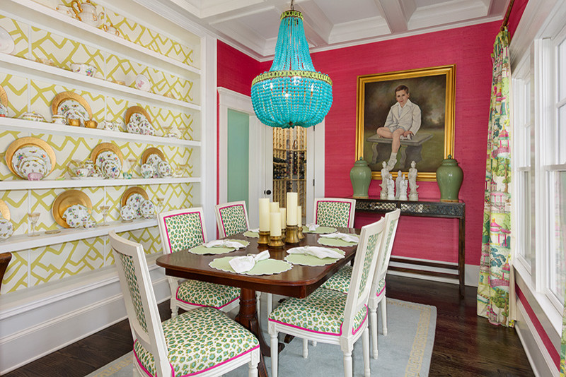 Medium sized eclectic enclosed dining room in Atlanta with pink walls, dark hardwood flooring and brown floors.