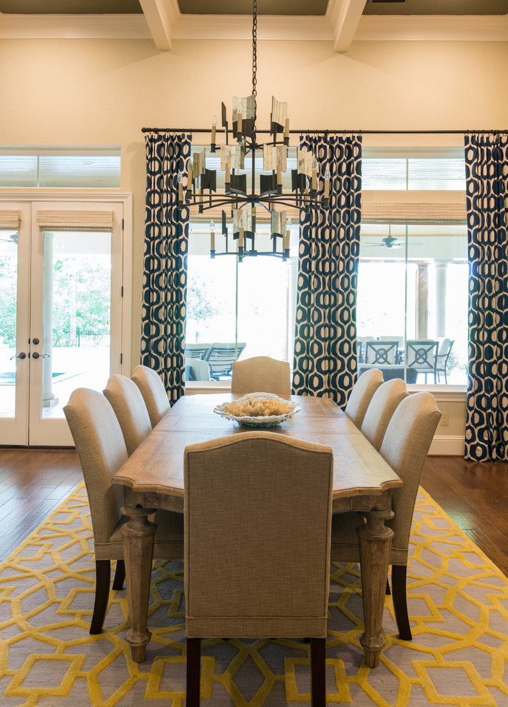 Dining room - mid-sized transitional medium tone wood floor, brown floor and coffered ceiling dining room idea in Houston with beige walls and no fireplace